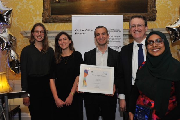 Here's a picture of our team winning the Cabinet Office Innovator Award in 2017. From left to right: Sophia and Rosa, two of our PhD placements, Chris Webber, head of our team, Rupert McNeil, Civil Service Chief People Officer, and Zahra Latif, who leads economic policy in the OIT.