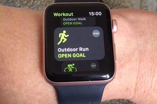 An Apple watch showing a running app on its screen.